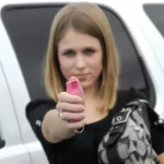 Sabre Red pink pepper spray featuring a durable hard case