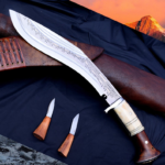 Shop the Handmade 10-Inch Khukuri Knife at Swords Kingdom. This high-carbon steel blade is hand-forged, full tang, and perfect for outdoor tasks or as a unique gift. Includes a wooden sheath and Karda & Chakmak knives.